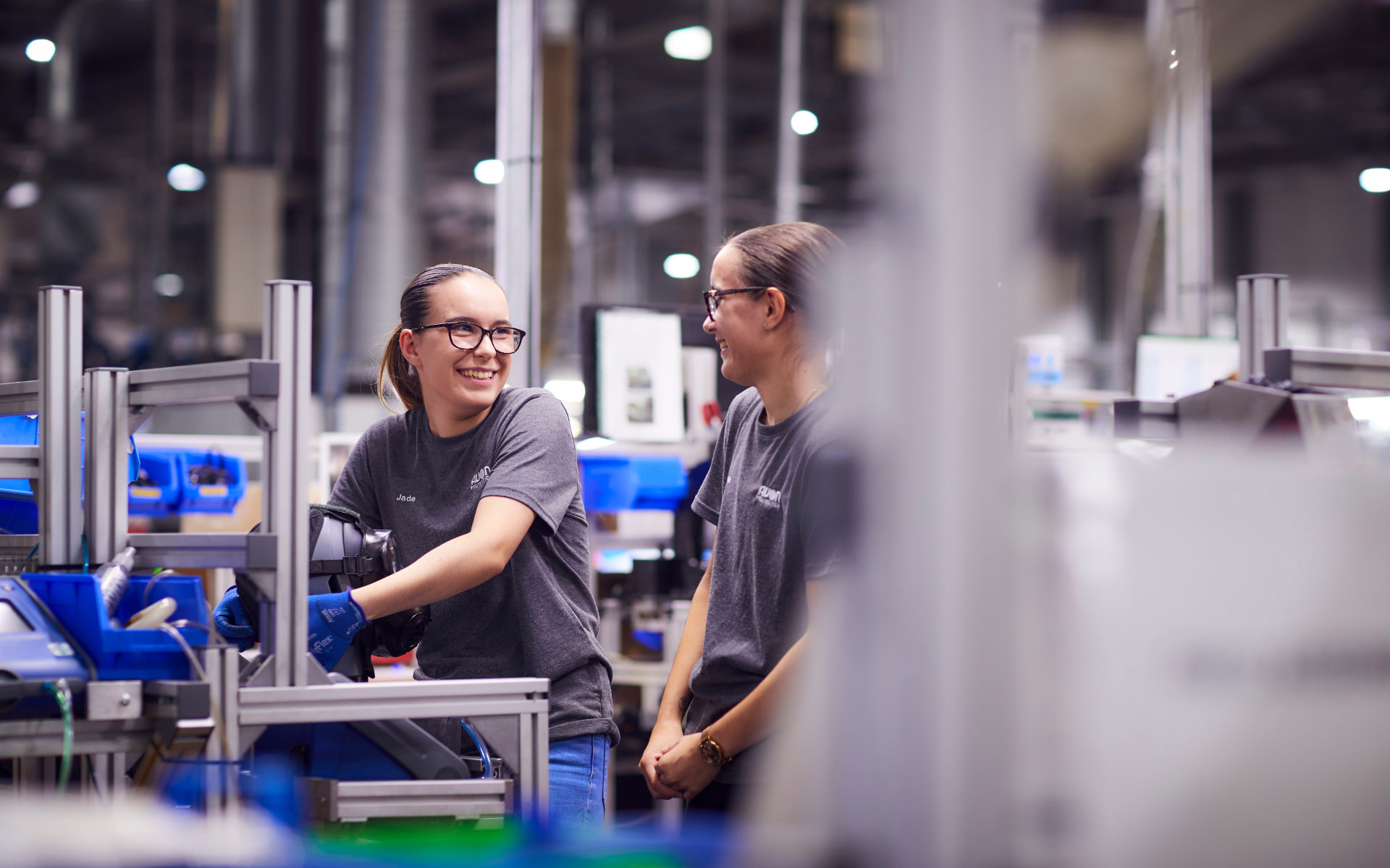 Two employees working on the production line