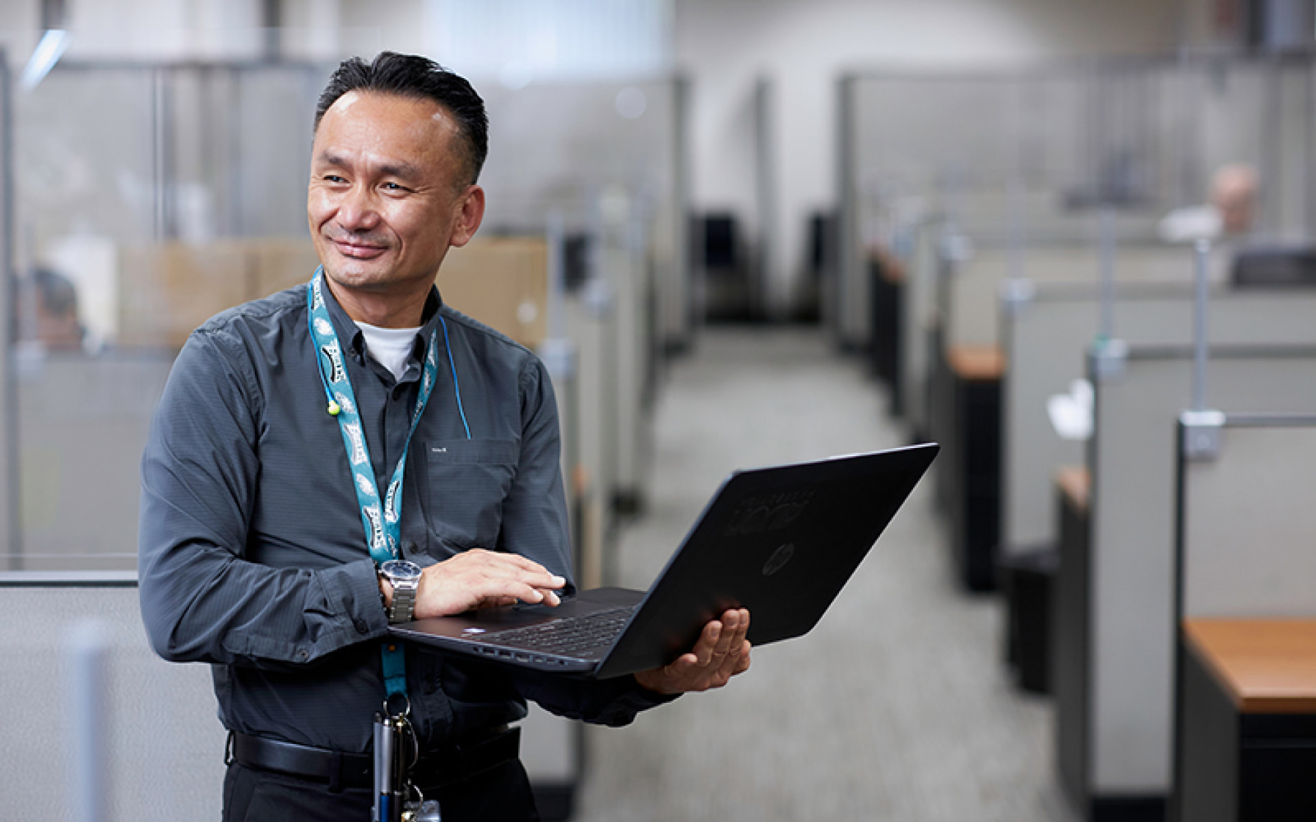 Employee using a laptop in an office