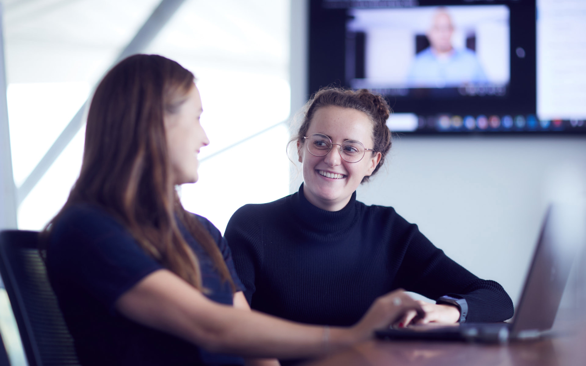 Employees having a meeting