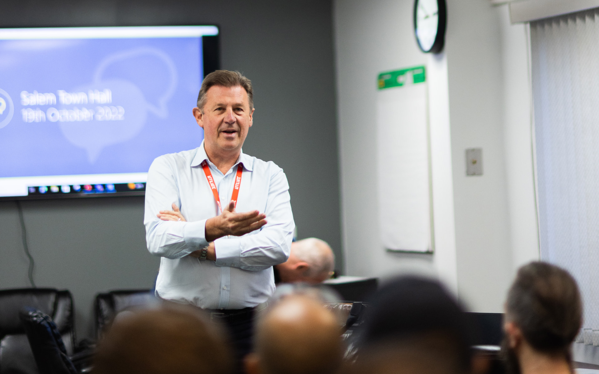 Chair, Bruce Thompson, presenting in front of employees