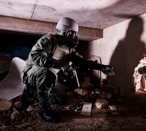 Soldier wearing a helmet and respirator