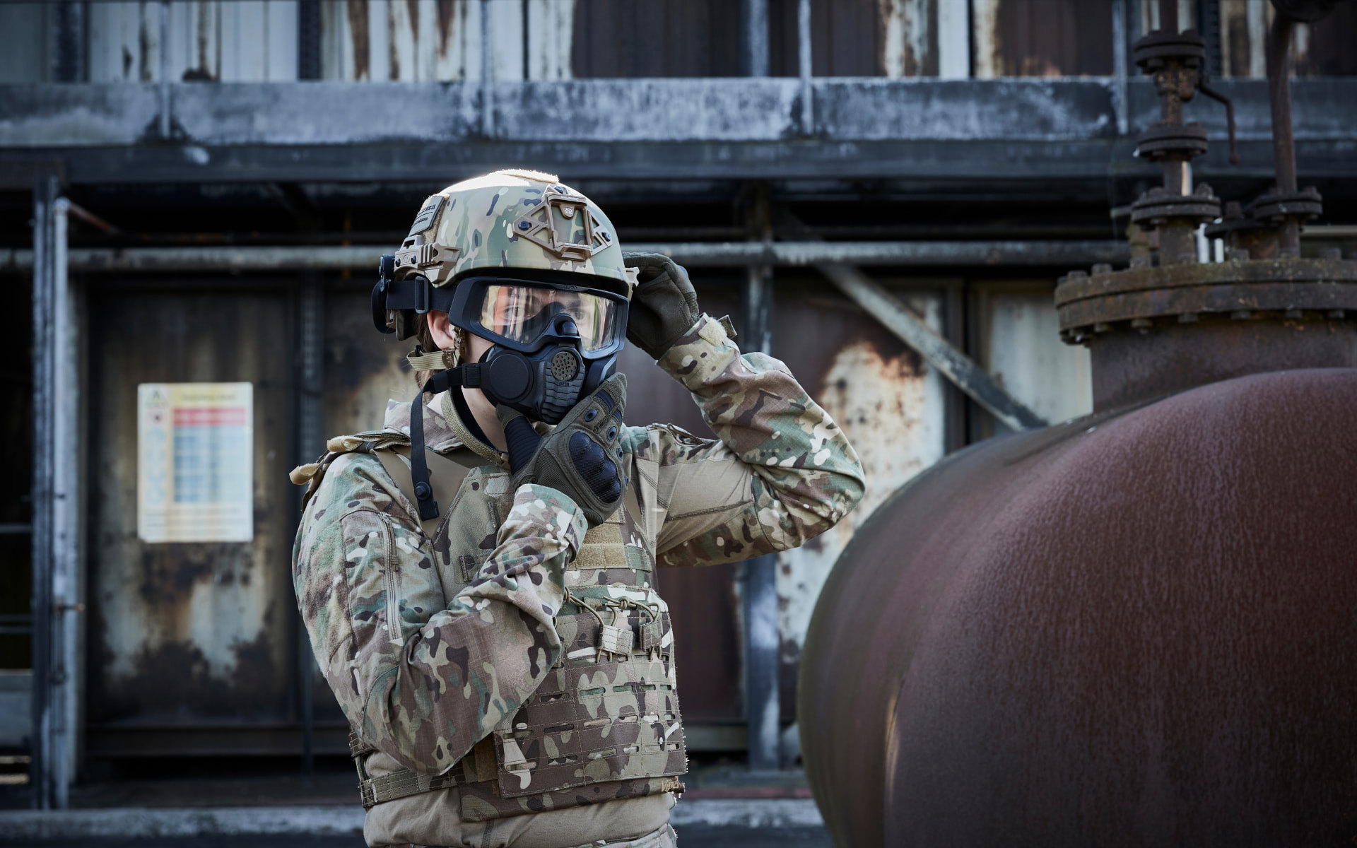 Solider donning mask